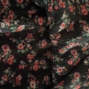 Grate long Tee it is made out of cotton the color is black with red flowers